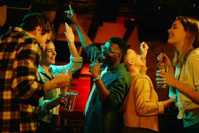 Friends singing karaoke