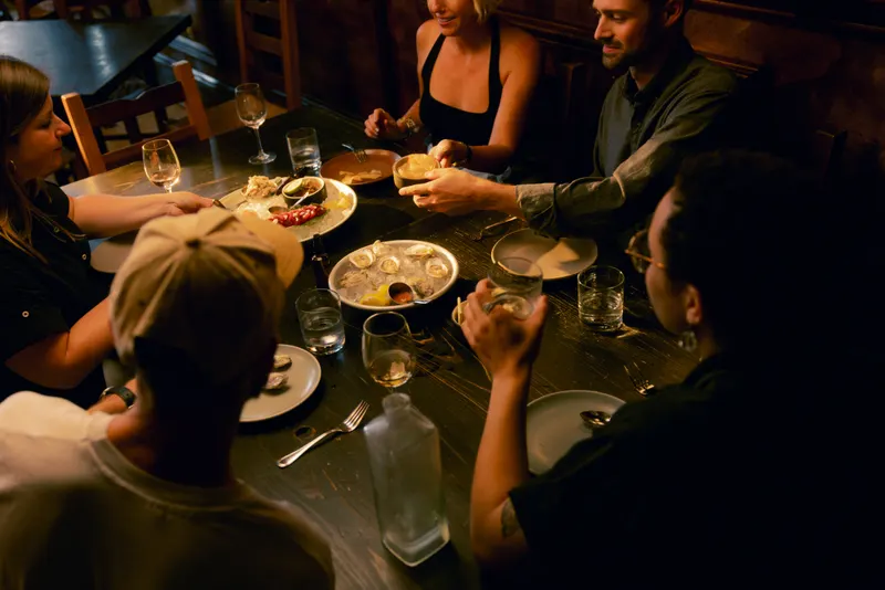 Friends sharing food and drinks